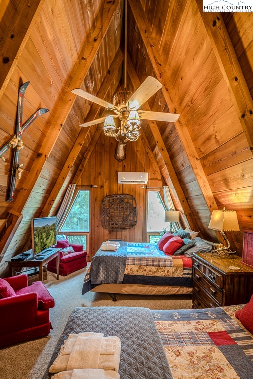 268 Cherry Drive Boone, NC 28607 - Photo 29 of 33 a bedroom with furniture and a chandelier