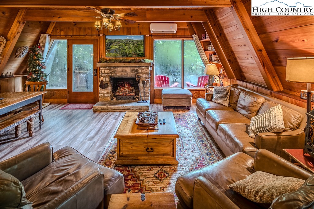 268 Cherry Drive Boone, NC 28607 - Photo 3 of 33 a bedroom with furniture and a fireplace