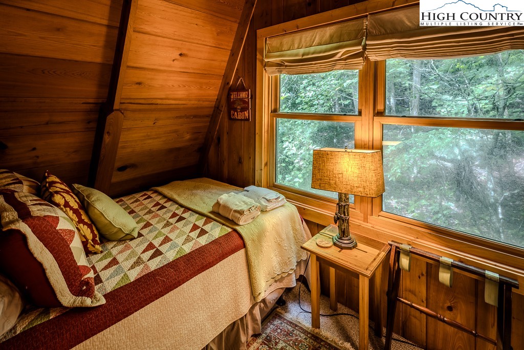 268 Cherry Drive Boone, NC 28607 - Photo 32 of 33 a bedroom with a bed and a window