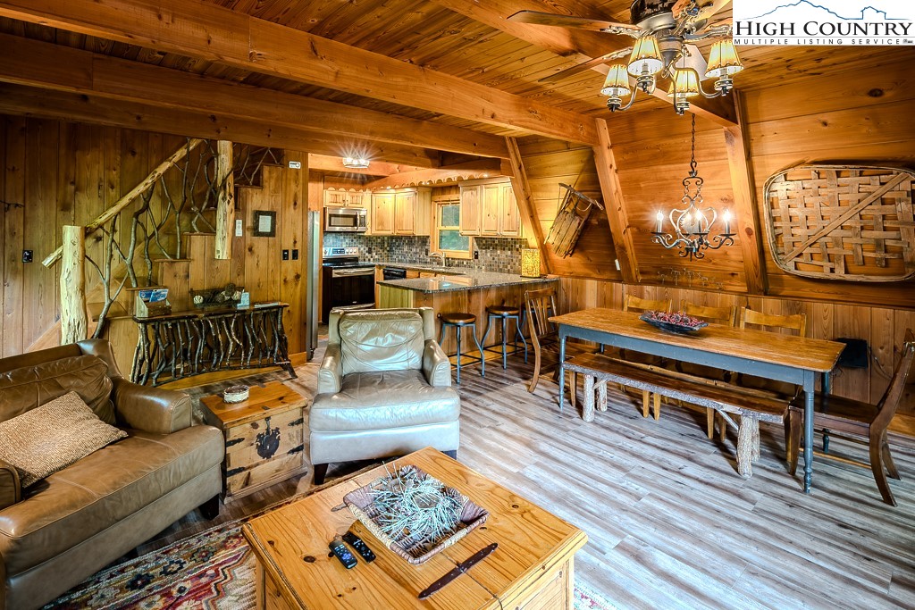 268 Cherry Drive Boone, NC 28607 - Photo 4 of 33 a living room with lots of furniture and a rug