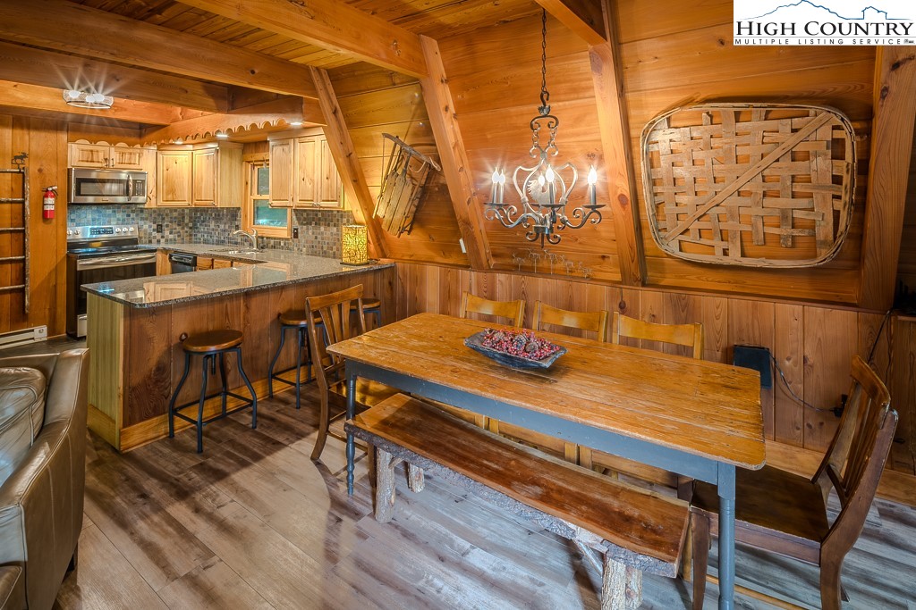 268 Cherry Drive Boone, NC 28607 - Photo 5 of 33 a view of a dining room with furniture and wooden floor