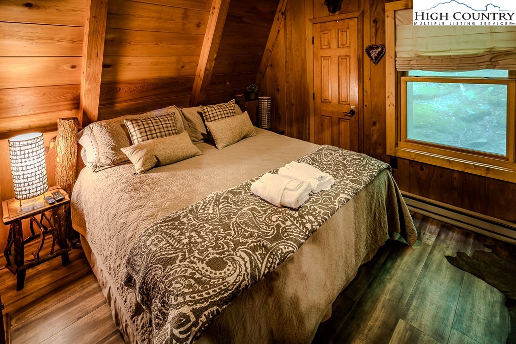 268 Cherry Drive Boone, NC 28607 - Photo 9 of 33 a bedroom with a bed and a window