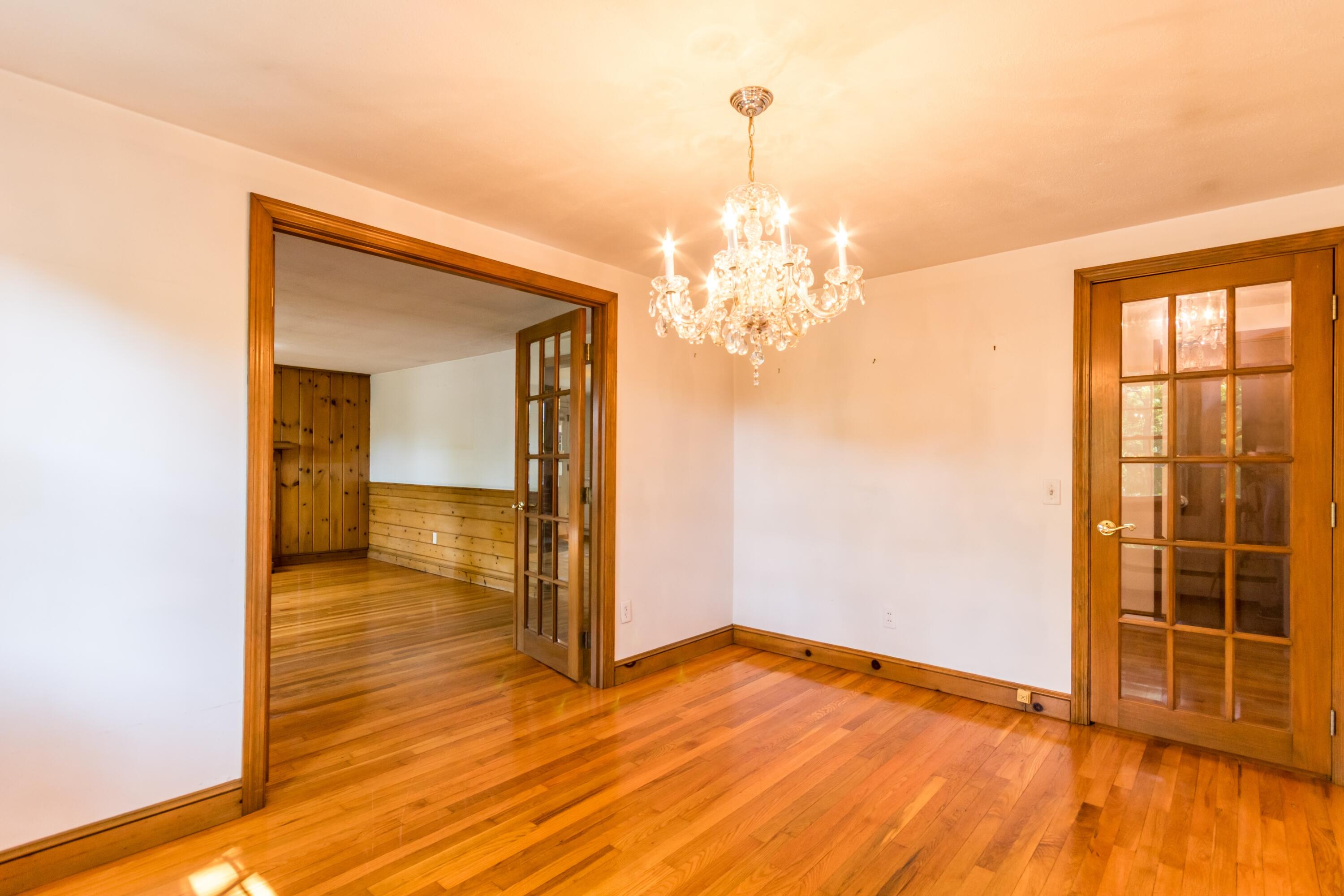 14 Ahab Road Yarmouth Port, MA 02675 - Photo 17 of 36 a view of empty room with wooden floor and fan