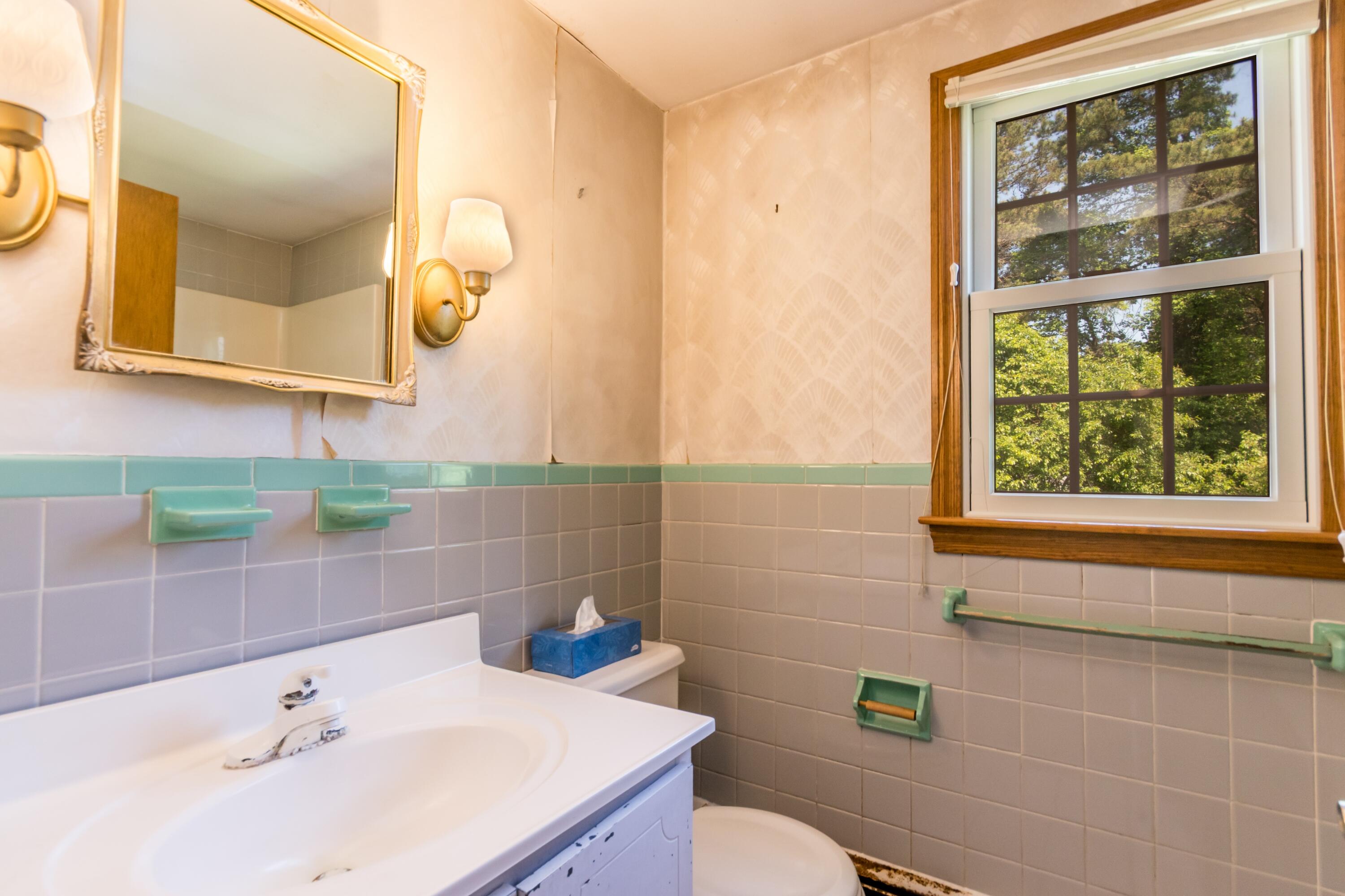 14 Ahab Road Yarmouth Port, MA 02675 - Photo 19 of 36 a bathroom with a sink a toilet and mirror