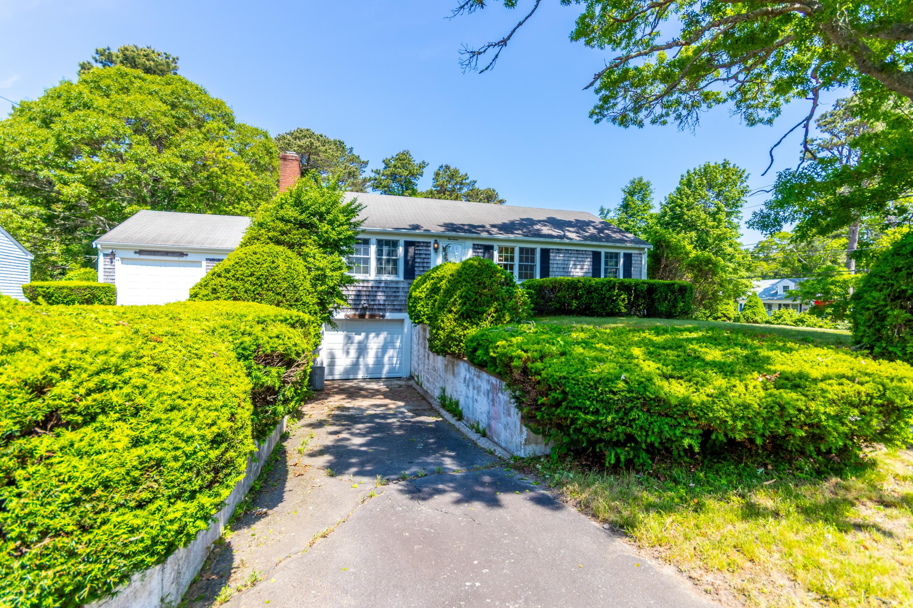 14 Ahab Road Yarmouth Port, MA 02675 - Photo 2 of 36 a view of a garden with a house