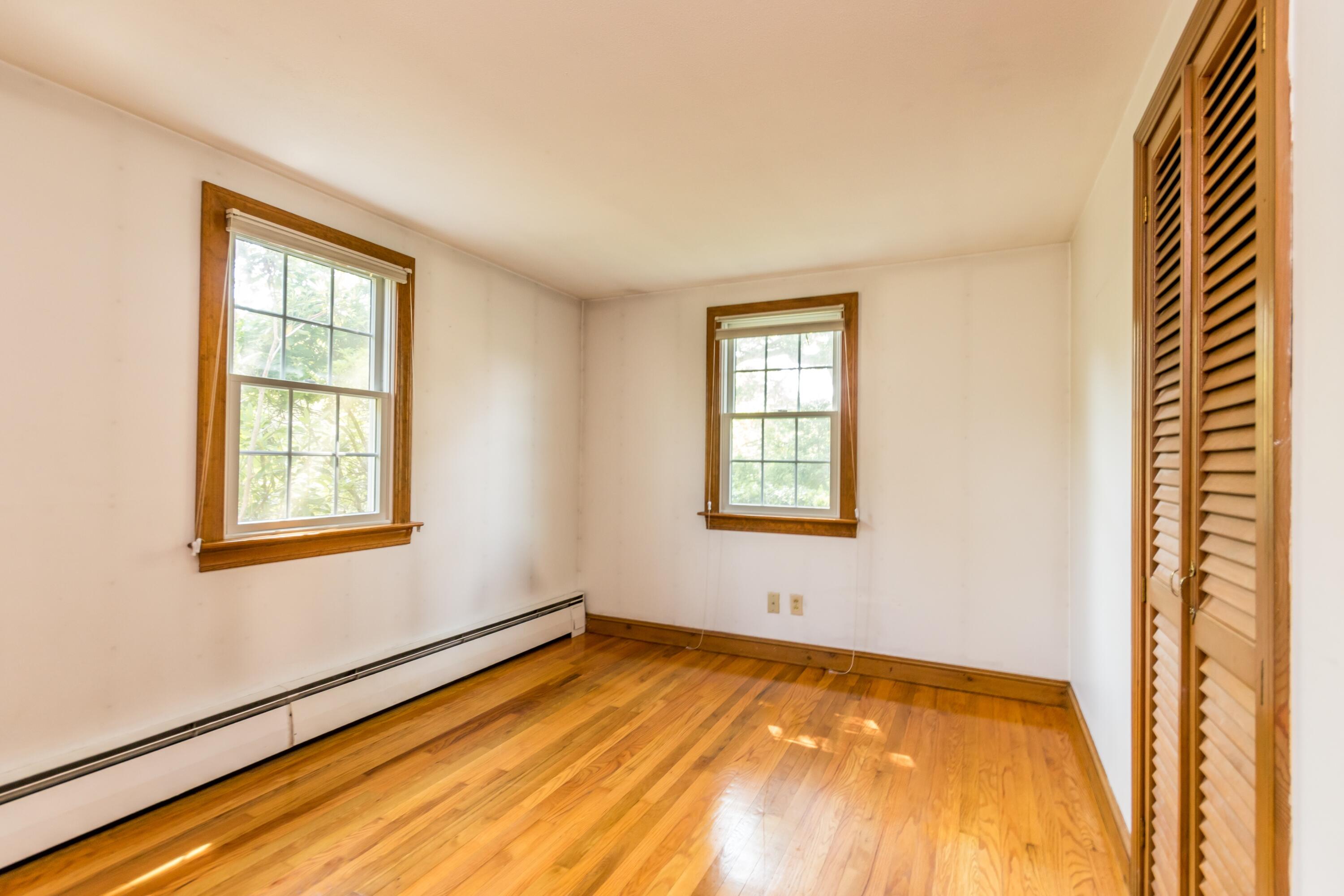 14 Ahab Road Yarmouth Port, MA 02675 - Photo 22 of 36 a view of an empty room with wooden floor and a window