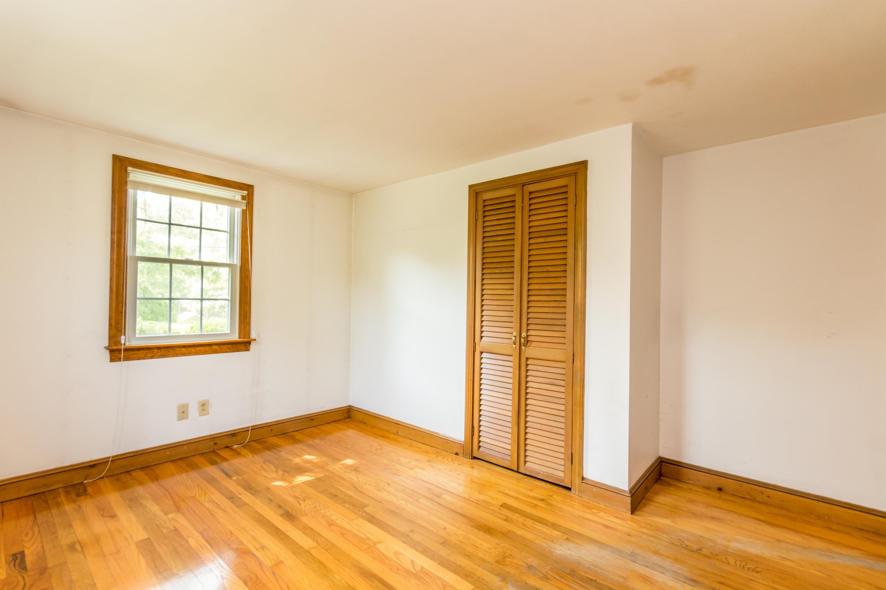 14 Ahab Road Yarmouth Port, MA 02675 - Photo 23 of 36 a view of an empty room with wooden floor and a window