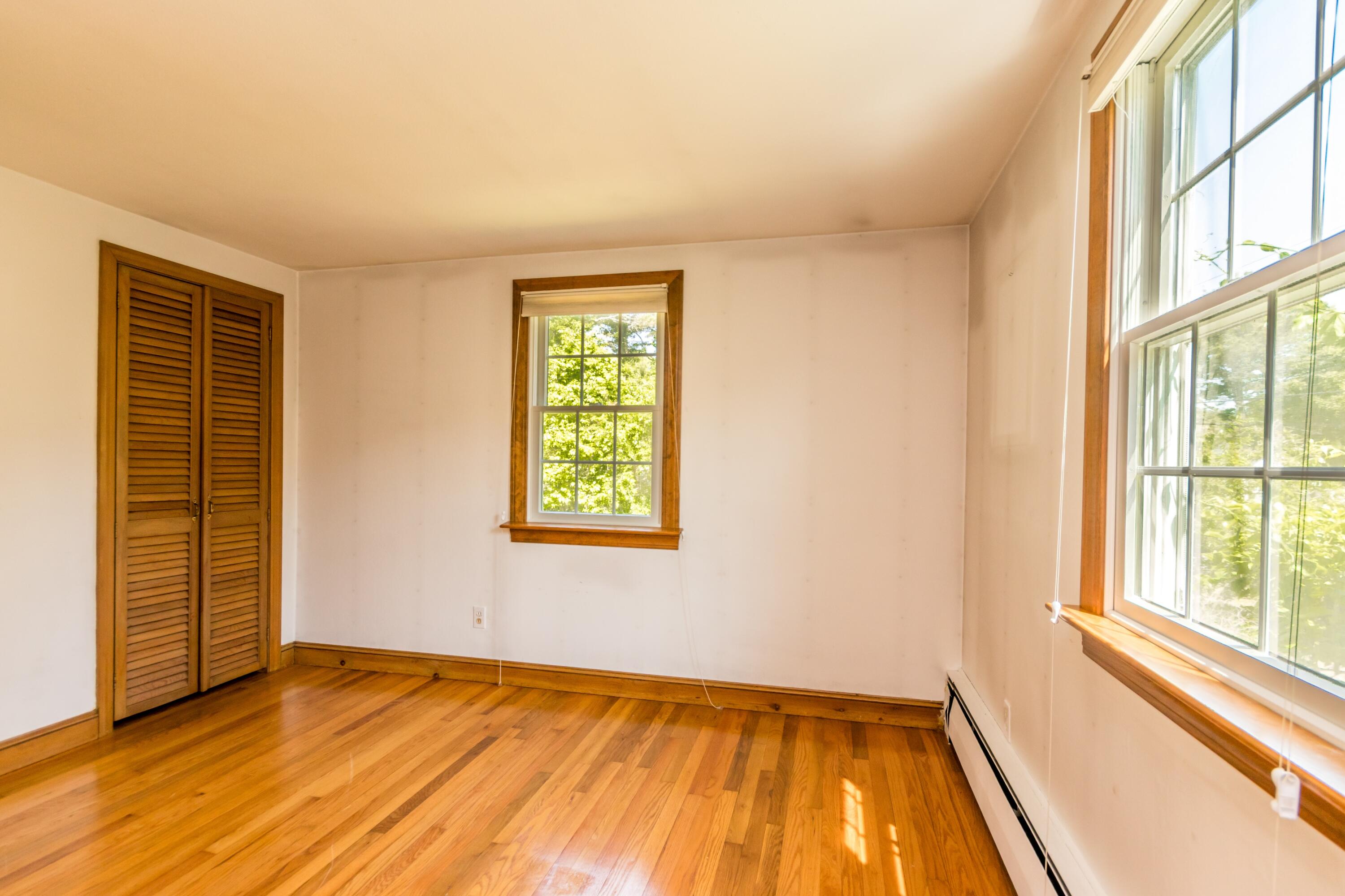 14 Ahab Road Yarmouth Port, MA 02675 - Photo 25 of 36 a view of an empty room with a window and wooden floor