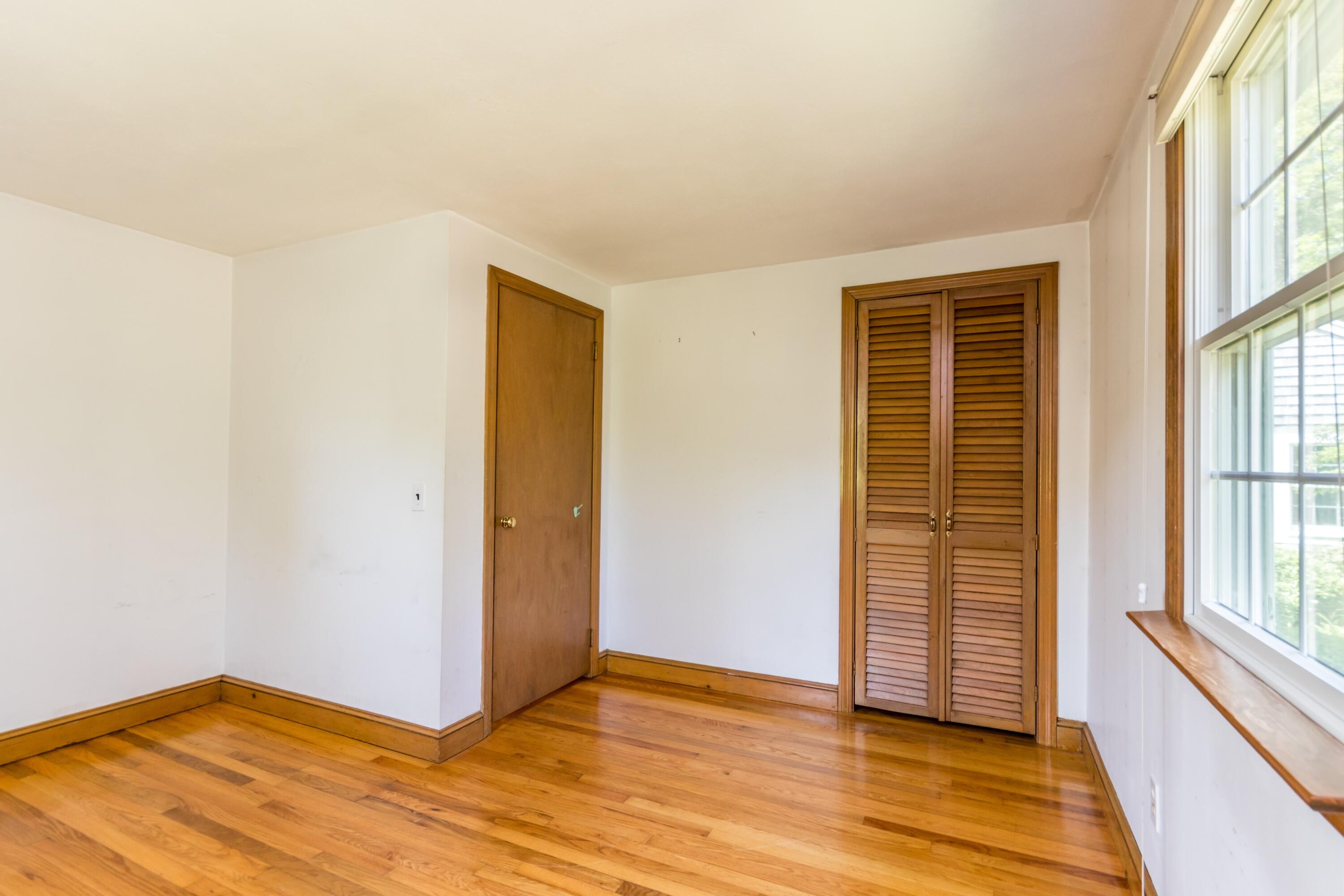 14 Ahab Road Yarmouth Port, MA 02675 - Photo 26 of 36 a view of an empty room with wooden floor and a window