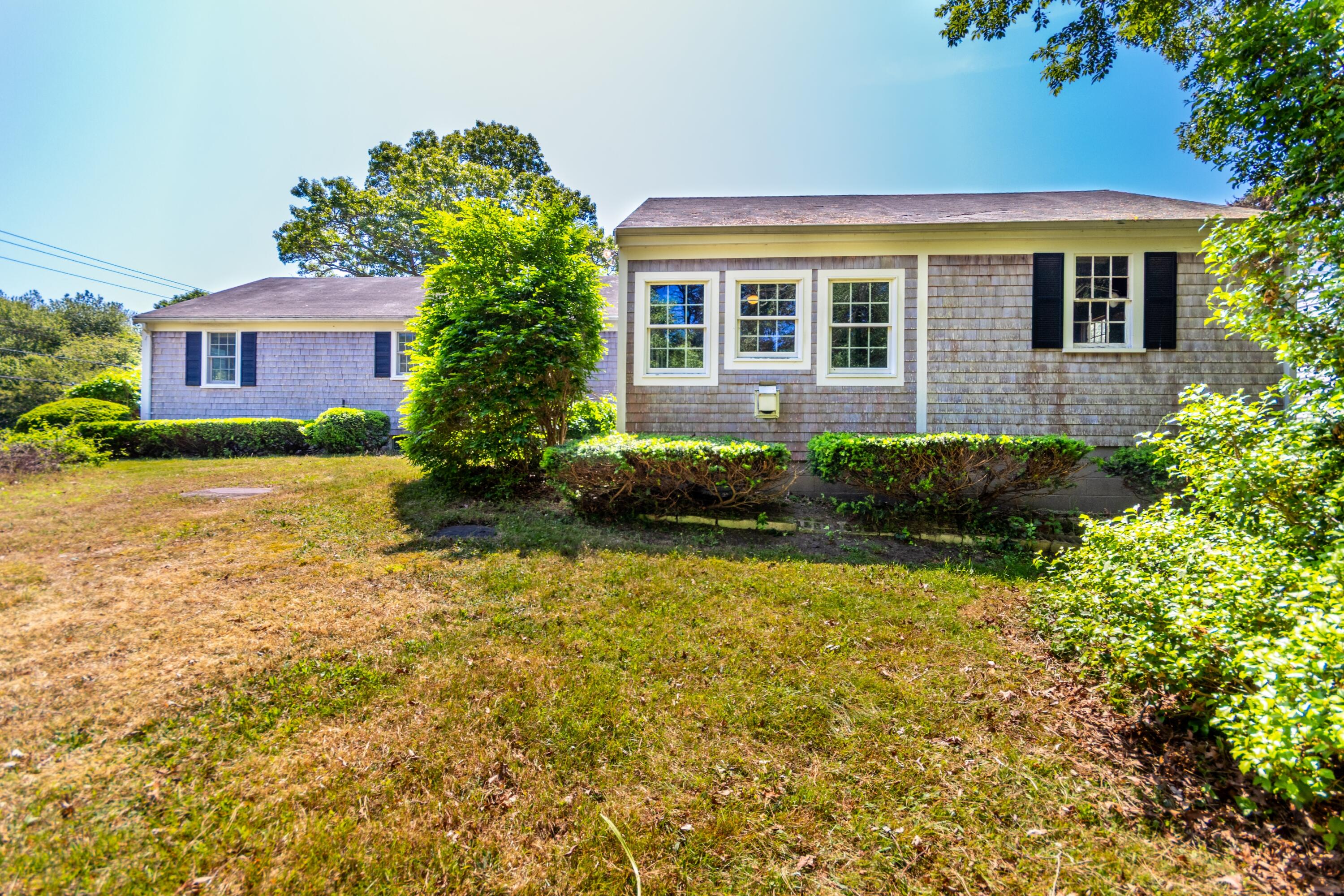 14 Ahab Road Yarmouth Port, MA 02675 - Photo 27 of 36 a view of a house with a garden