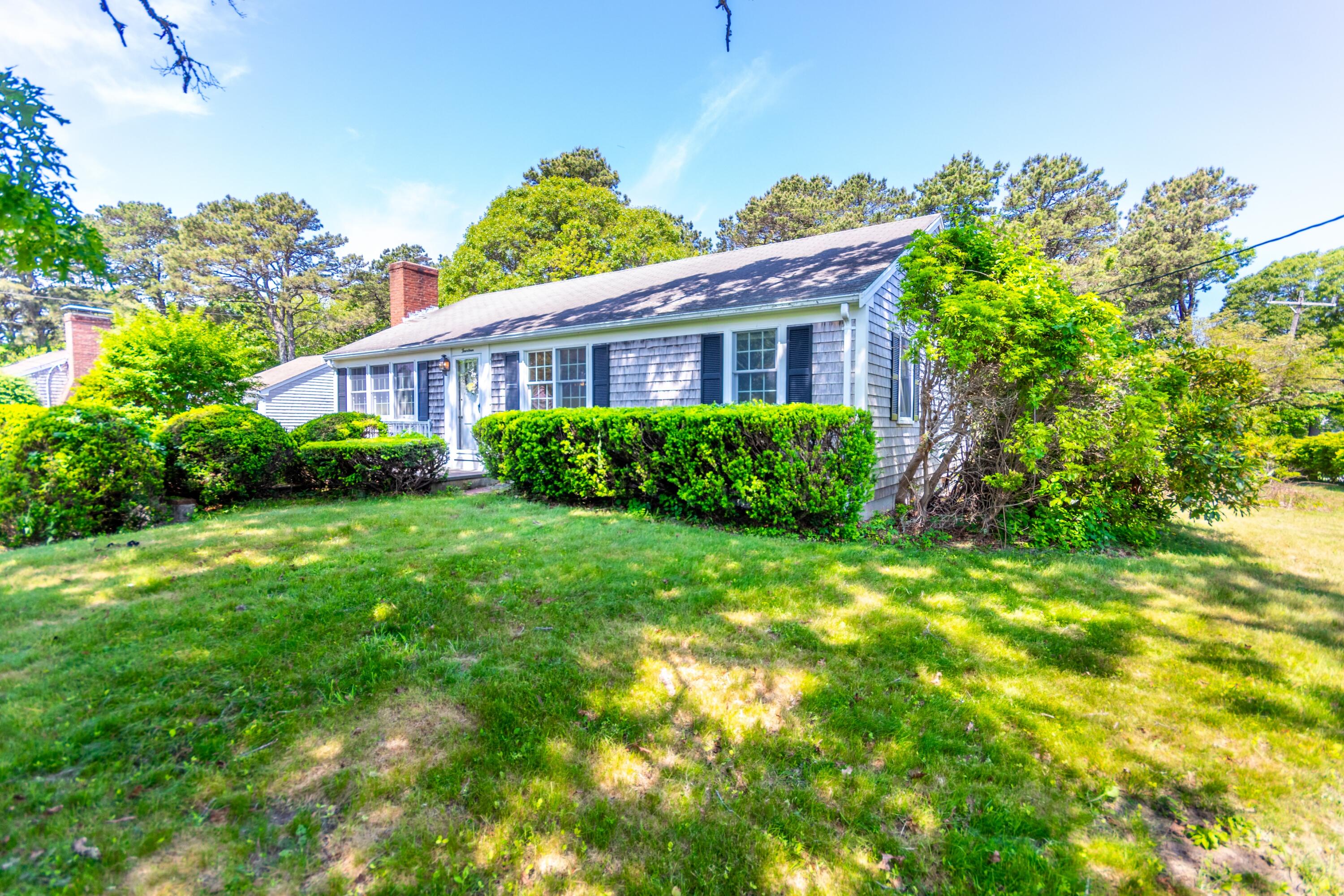 14 Ahab Road Yarmouth Port, MA 02675 - Photo 30 of 36 a view of a house with garden and plants