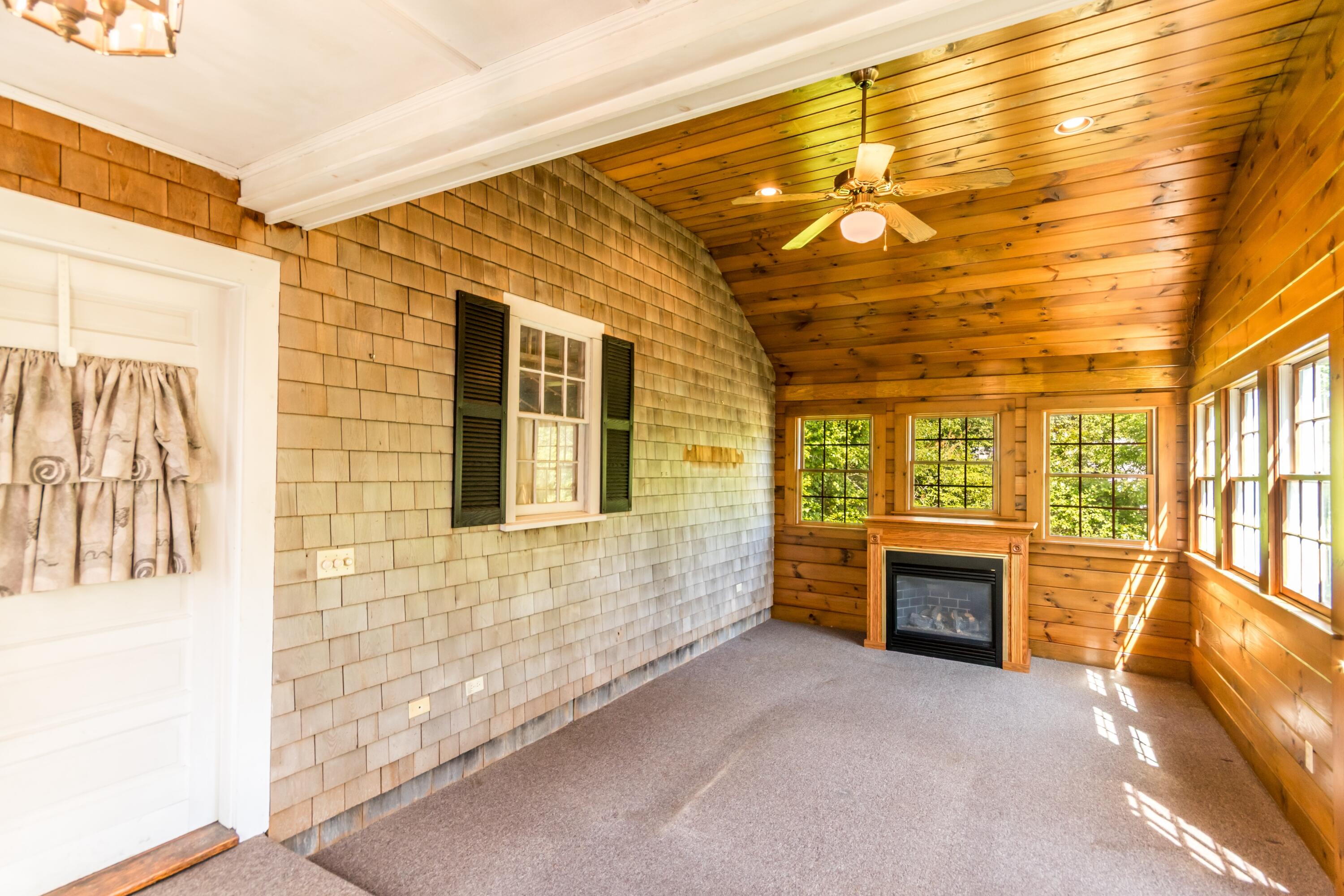 14 Ahab Road Yarmouth Port, MA 02675 - Photo 5 of 36 a view of empty room with a fireplace