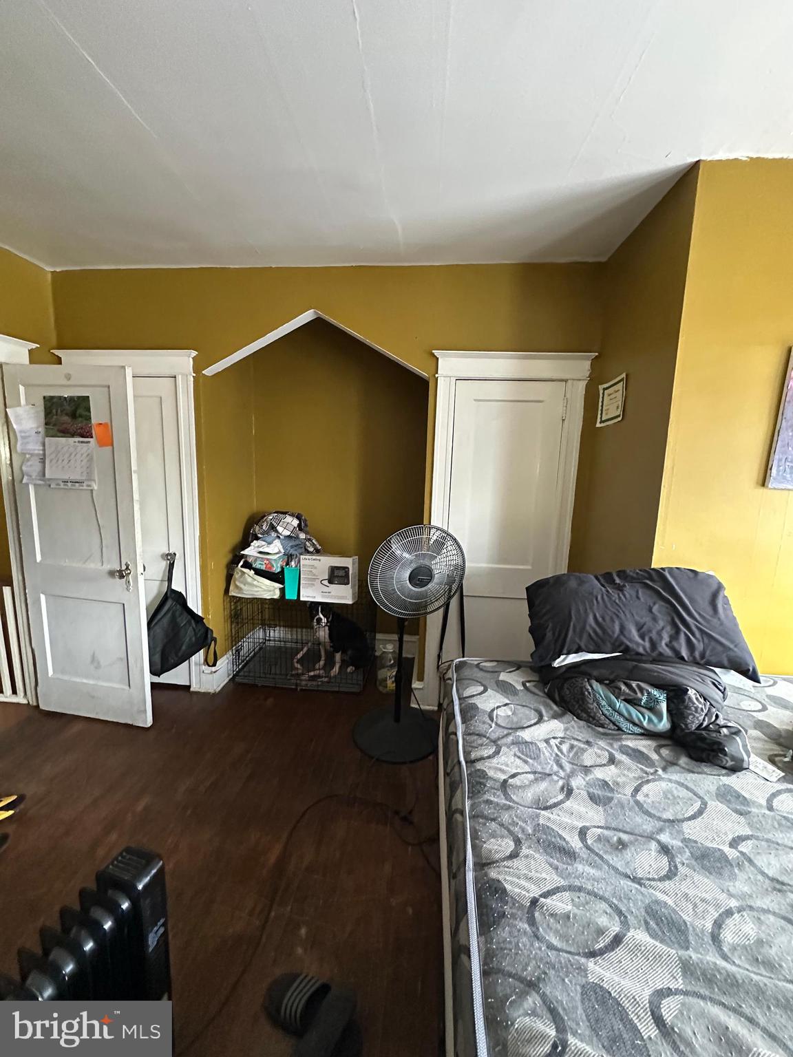 5039 F Street Philadelphia, PA 19124 - Photo 2 of 14 a bedroom with a bed and a large mirror