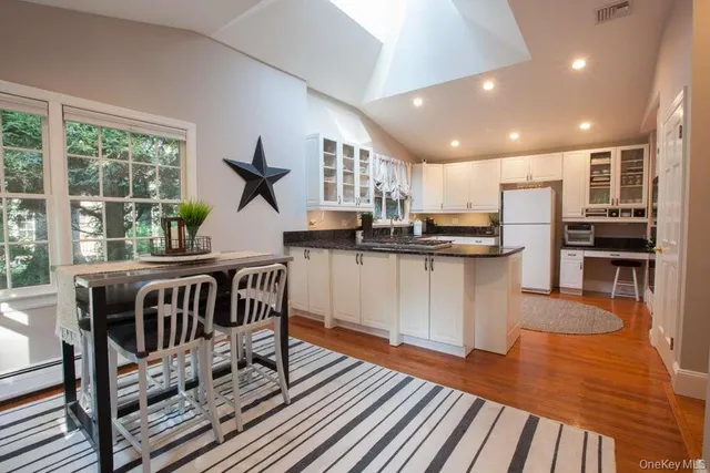 a kitchen with stainless steel appliances granite countertop a stove and a sink