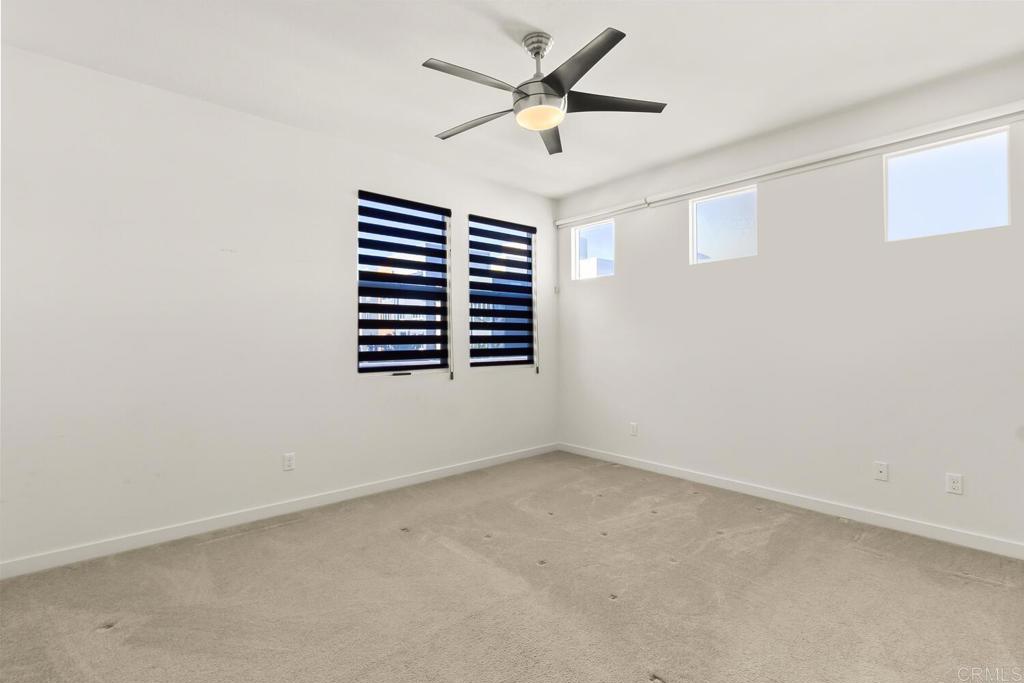 2012 Foxtrot Loop, Unit 3 Chula Vista, CA 91915 - Photo 17 of 34 an empty room with a window and a fan