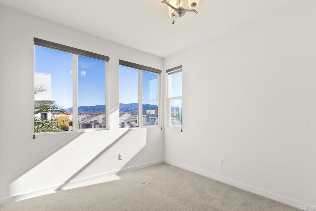 2012 Foxtrot Loop, Unit 3 Chula Vista, CA 91915 - Photo 24 of 34 a bed room with a bed and a window