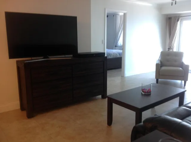 a living room with furniture and a rug