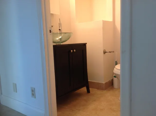 a bathroom with a sink and toilet