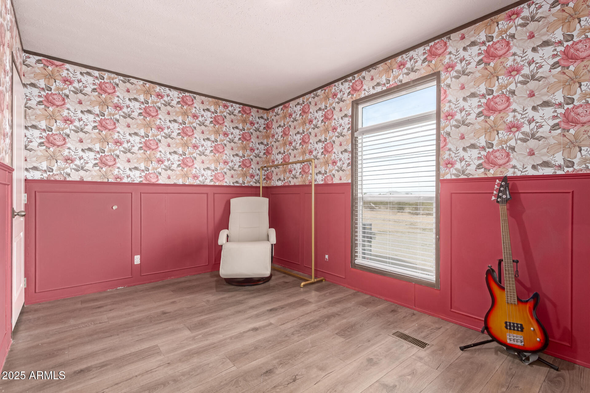 18709 West Riggs Road Buckeye, AZ 85326 - Photo 20 of 29 a room with wooden floor and a window