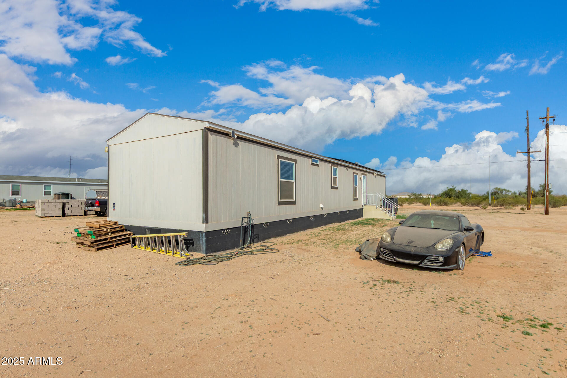 18709 West Riggs Road Buckeye, AZ 85326 - Photo 27 of 29 a front view of a house with a yard