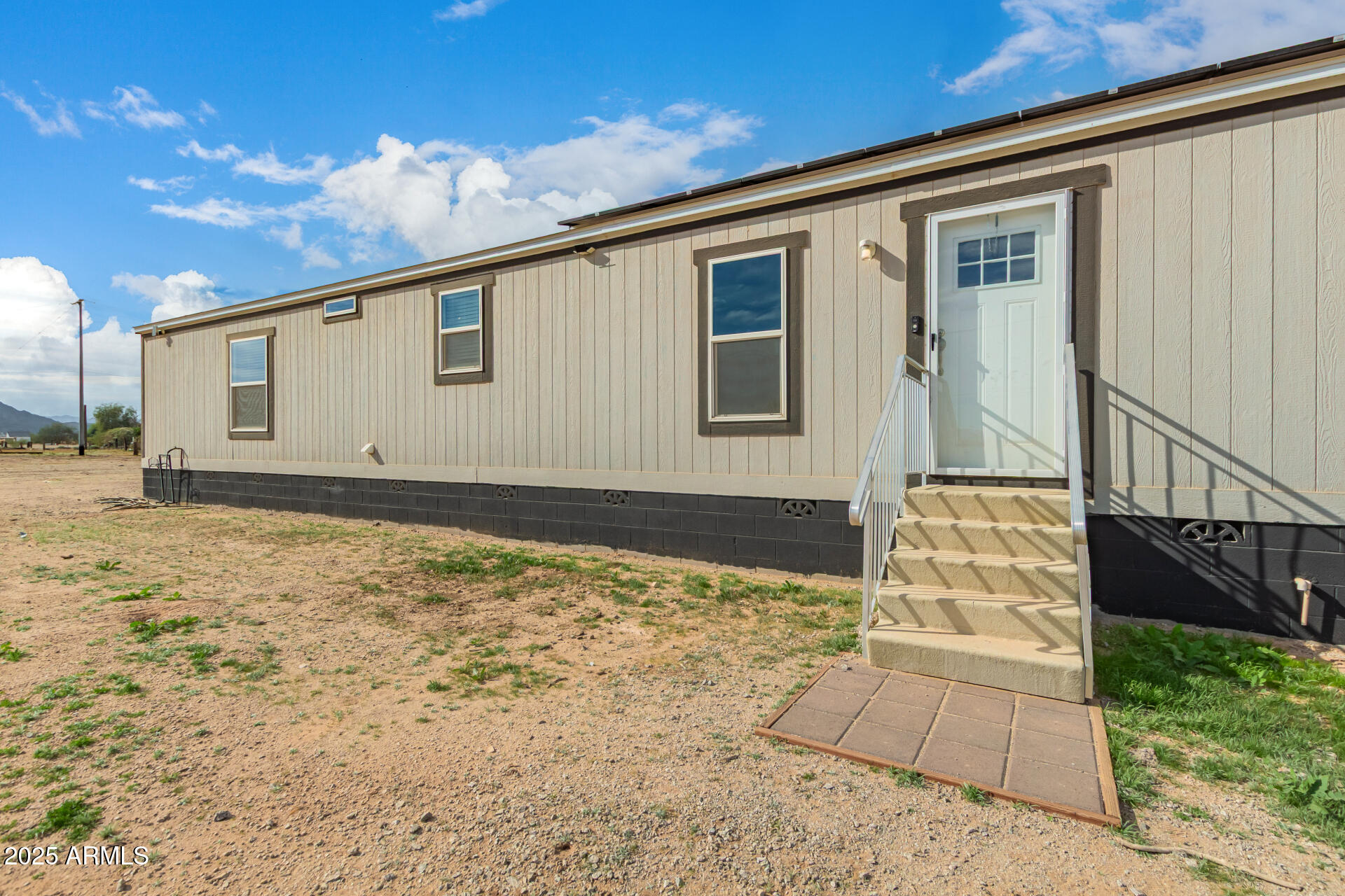 18709 West Riggs Road Buckeye, AZ 85326 - Photo 28 of 29 a front view of a house with a yard