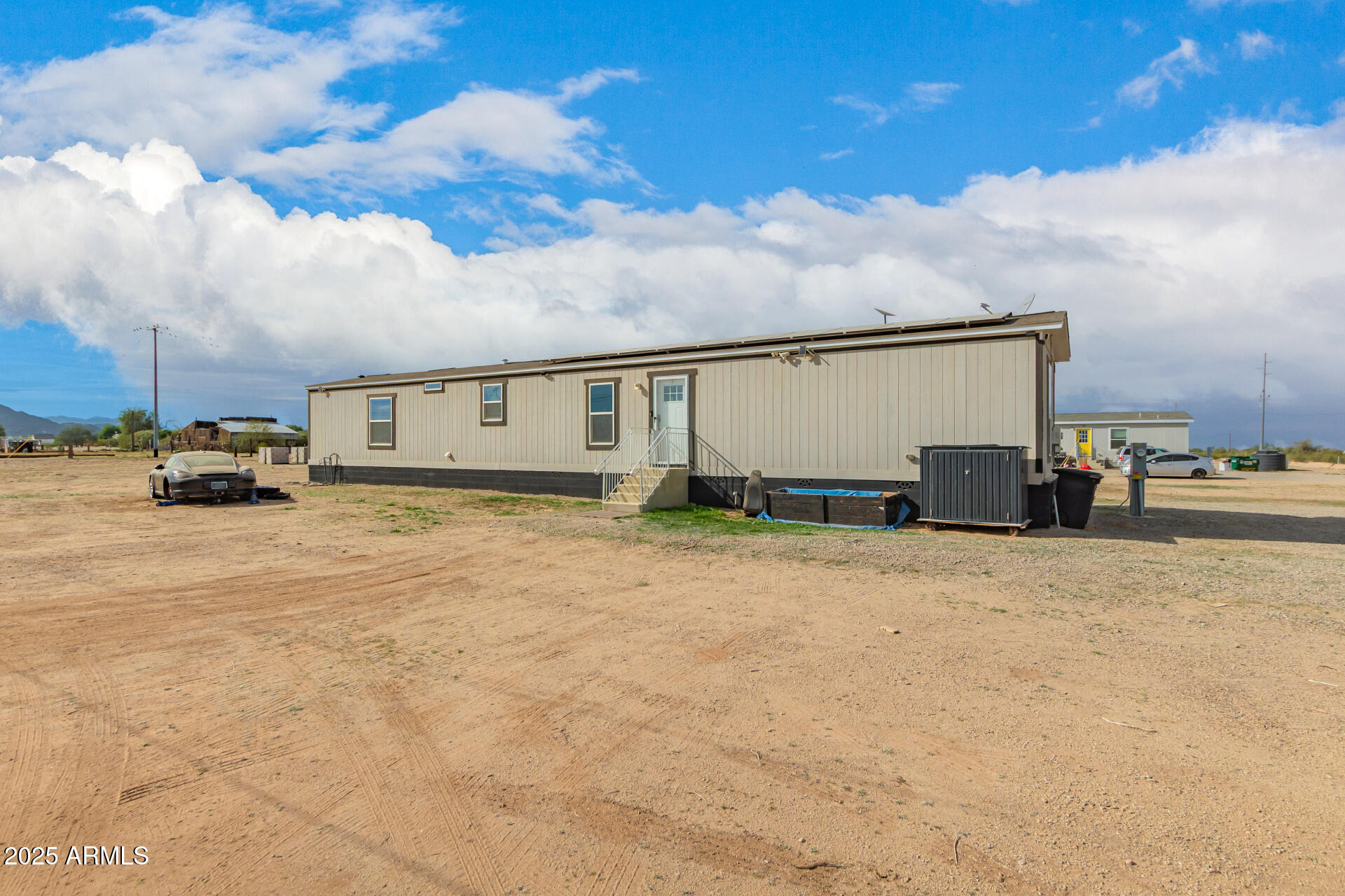 18709 West Riggs Road Buckeye, AZ 85326 - Photo 29 of 29 a view of car parked in front of house