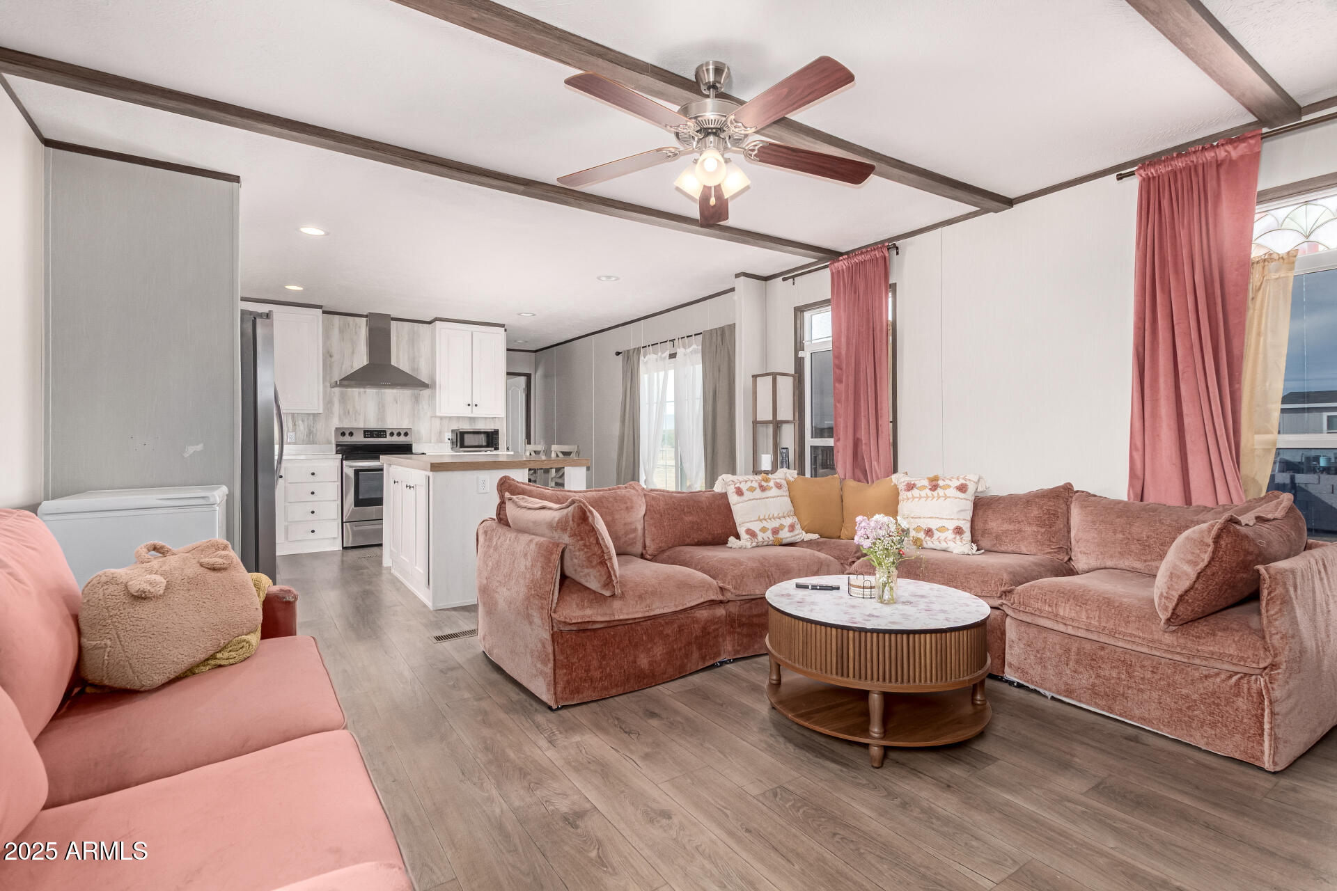 18709 West Riggs Road Buckeye, AZ 85326 - Photo 3 of 29 a living room with furniture and a large window