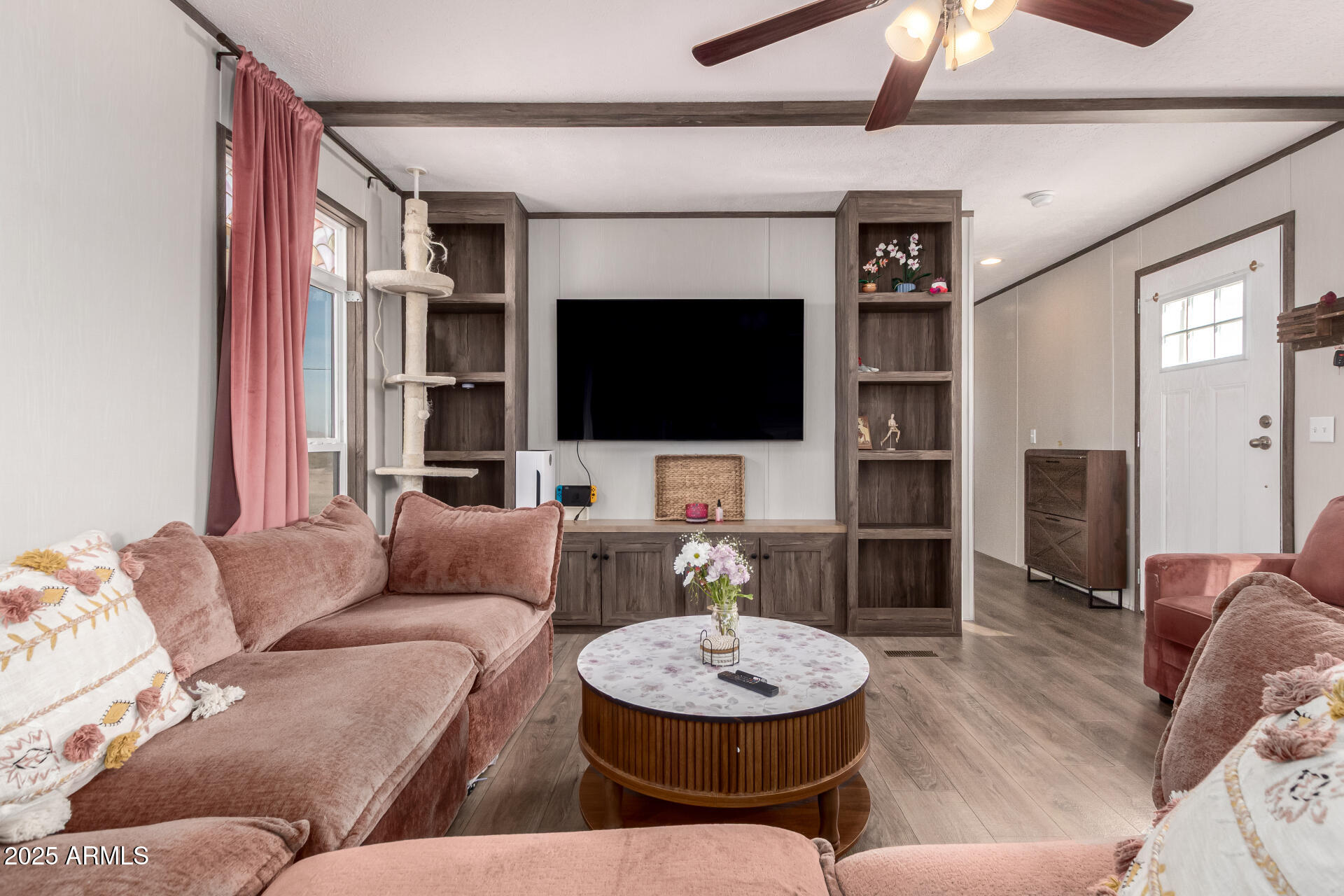 18709 West Riggs Road Buckeye, AZ 85326 - Photo 6 of 29 a living room with furniture and a flat screen tv