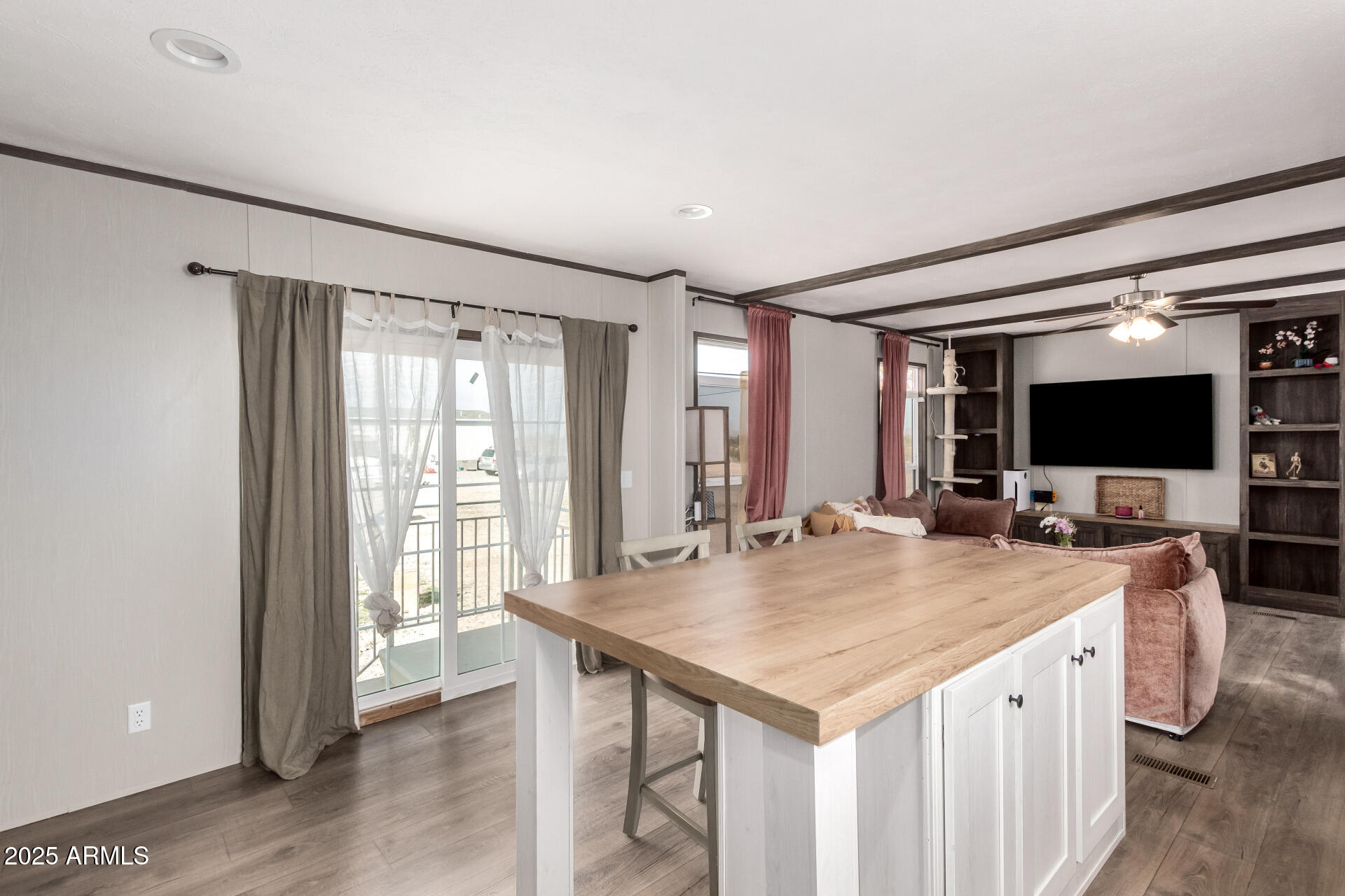18709 West Riggs Road Buckeye, AZ 85326 - Photo 8 of 29 a view of kitchen island a sink and a refrigerator