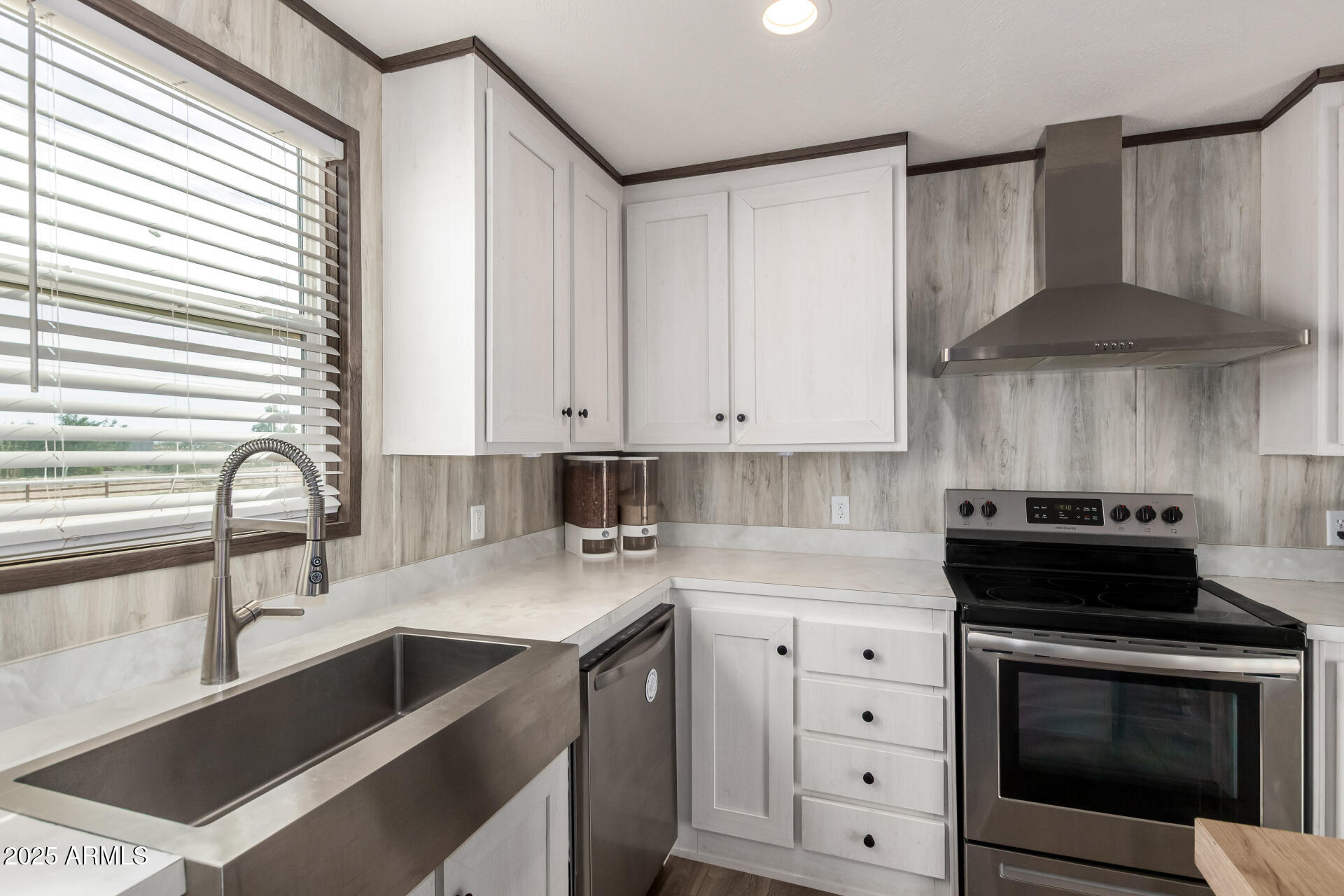 18709 West Riggs Road Buckeye, AZ 85326 - Photo 10 of 29 a kitchen with cabinets appliances and a sink