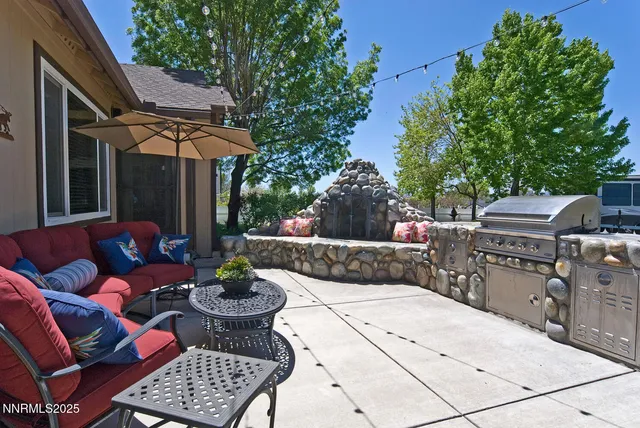 a bed sitting in a bedroom next to a lamp