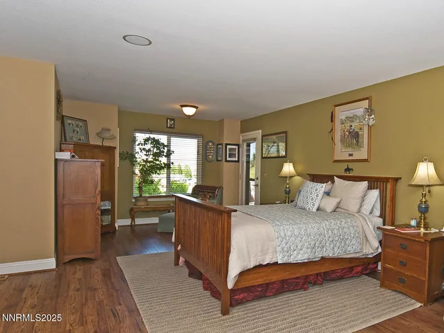a bathroom with a double vanity sink mirror and next to a window