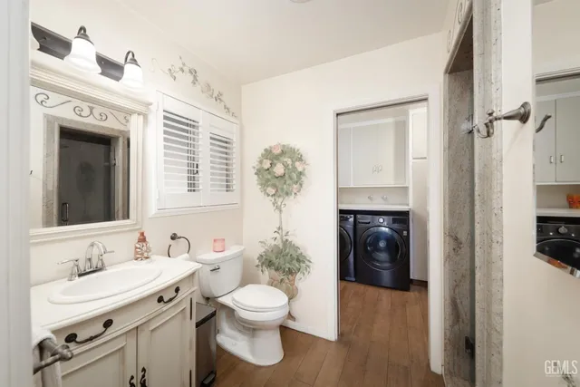a spacious bathroom with a sink a toilet and shower