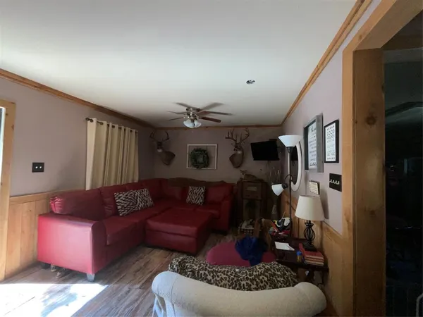 a living room with furniture and a rug