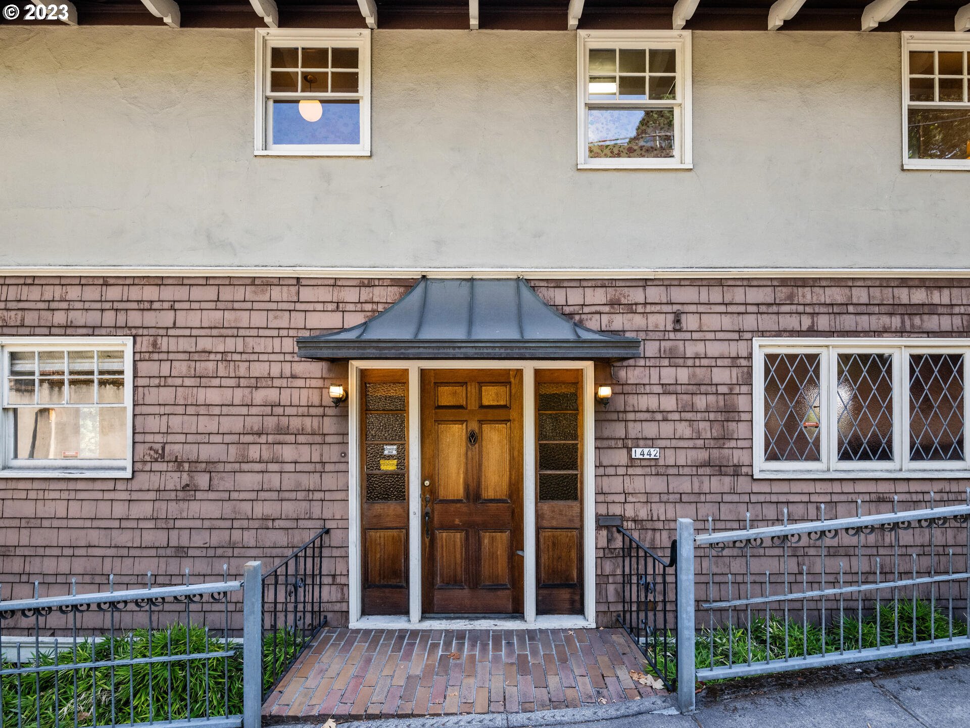 1442 Southwest Vista Avenue Portland, OR 97201 - Photo 2 of 46 a front view of a house with a door