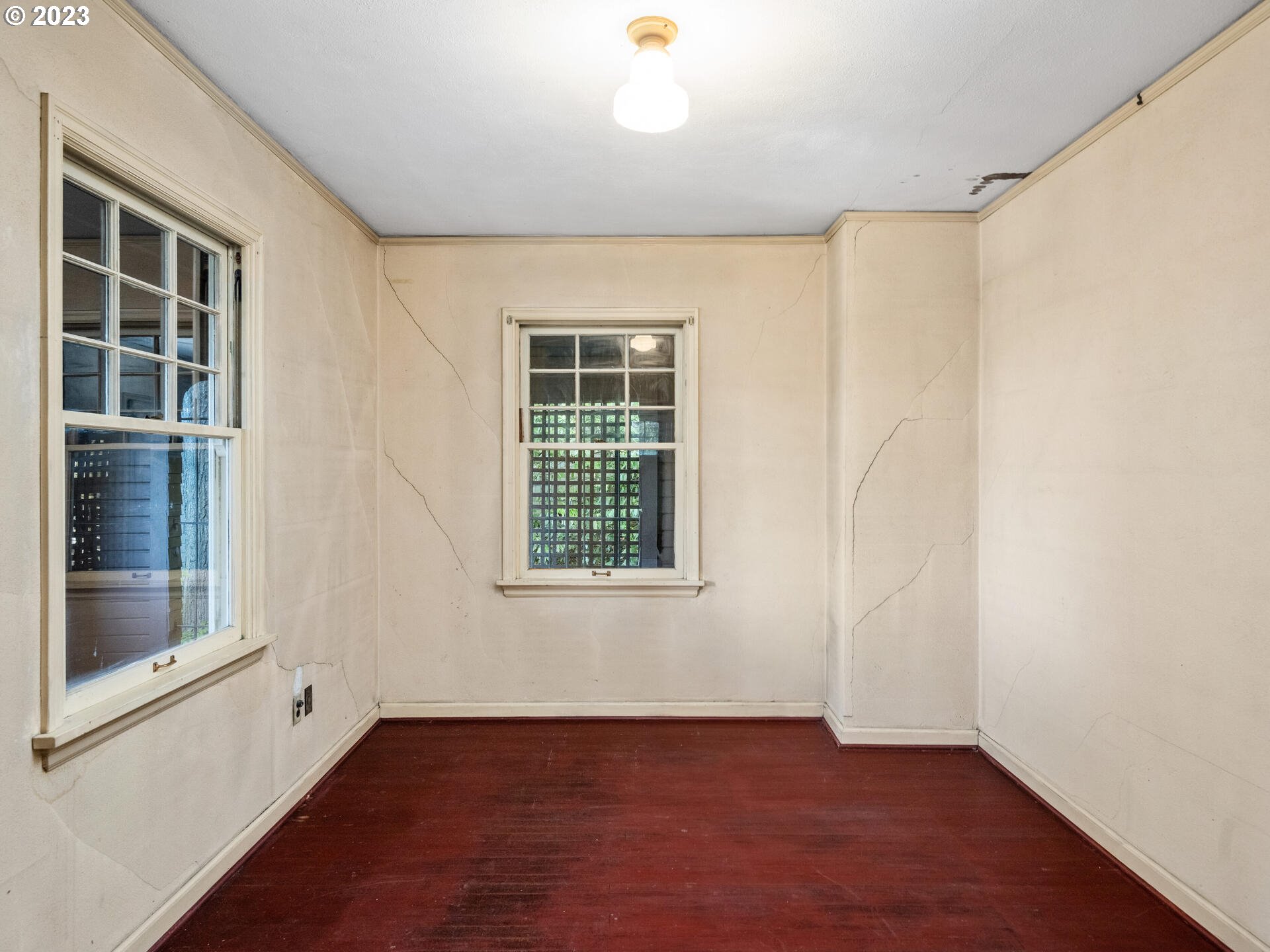 1442 Southwest Vista Avenue Portland, OR 97201 - Photo 37 of 46 an empty room with wooden floor and windows
