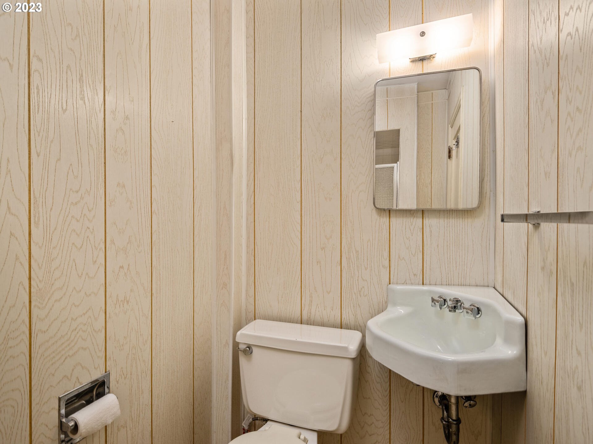 1442 Southwest Vista Avenue Portland, OR 97201 - Photo 39 of 46 a bathroom with a sink a toilet and a mirror