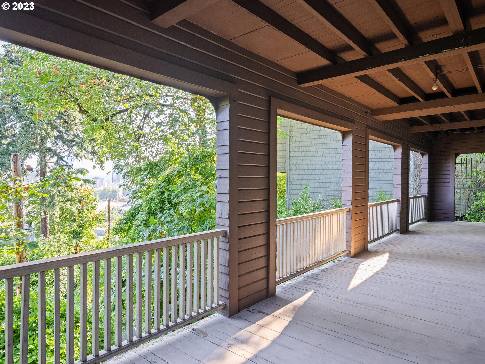 1442 Southwest Vista Avenue Portland, OR 97201 - Photo 41 of 46 a view of a porch with wooden floor and stairs