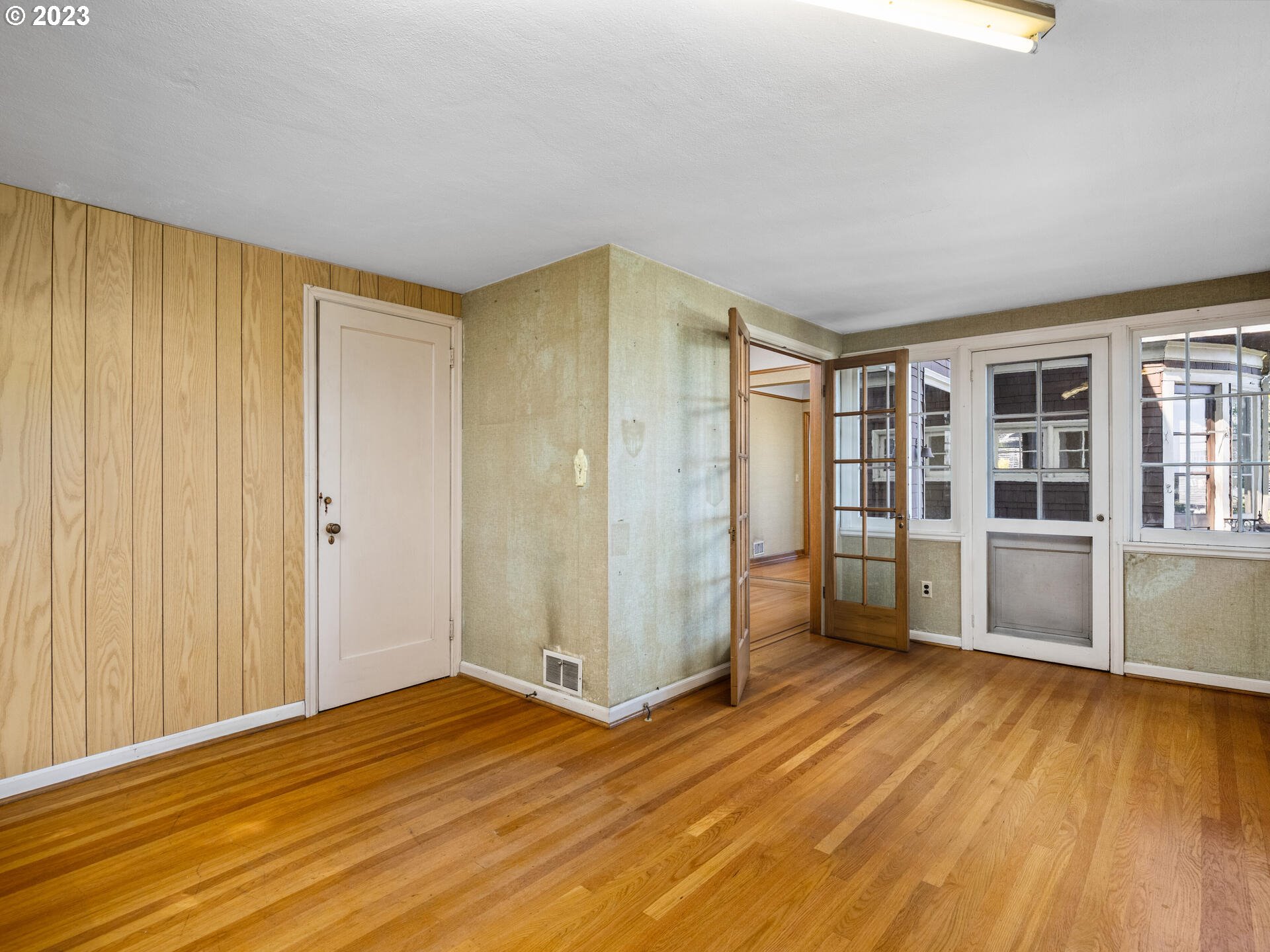 1442 Southwest Vista Avenue Portland, OR 97201 - Photo 8 of 46 a view of empty room with wooden floor and fan