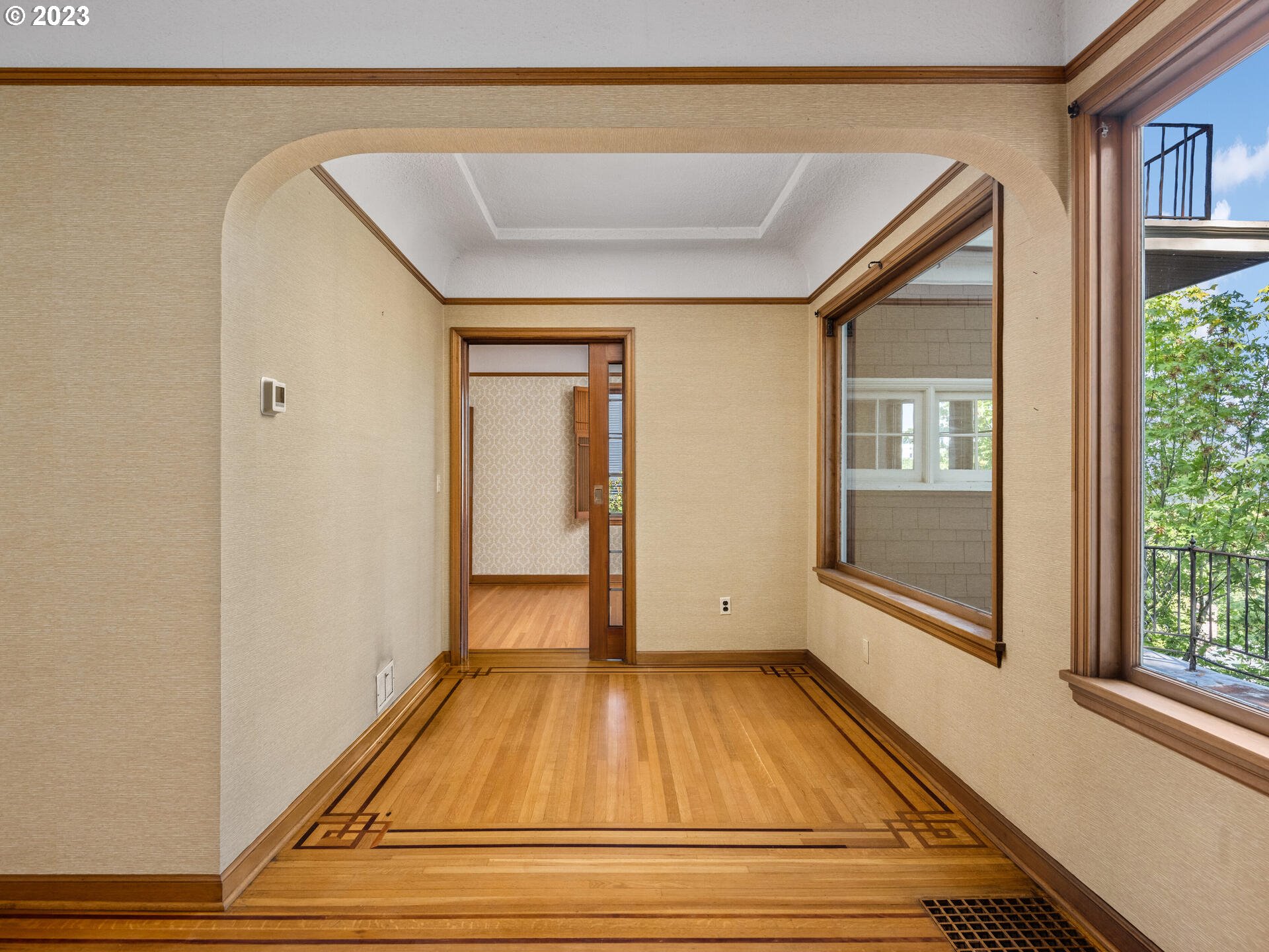 1442 Southwest Vista Avenue Portland, OR 97201 - Photo 10 of 46 a view of a room with wooden floor and windows