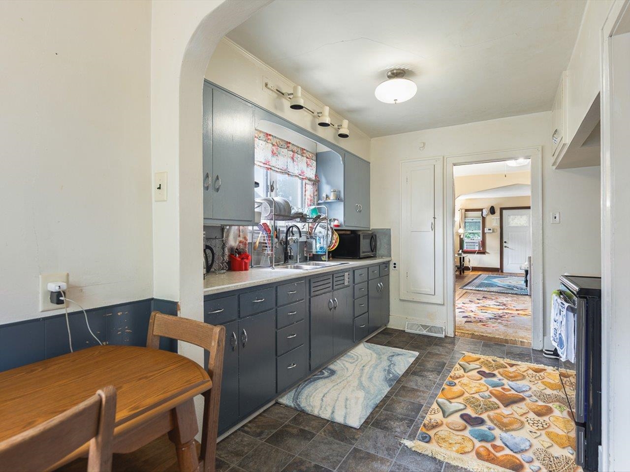 1247 West Logan Street Freeport, IL 61032 - Photo 14 of 34 a kitchen with a table and chairs in it