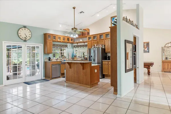 a kitchen with stainless steel appliances granite countertop a sink and a cabinets