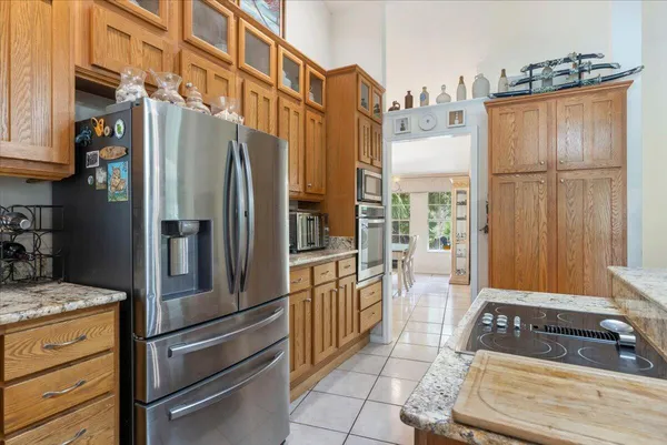 a view of a hallway and wooden floor and a livingroom