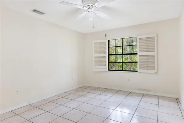 a bed room with a bed and a view of bathroom