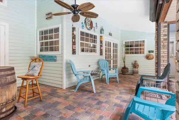 a view of balcony with wooden floor and outdoor seating