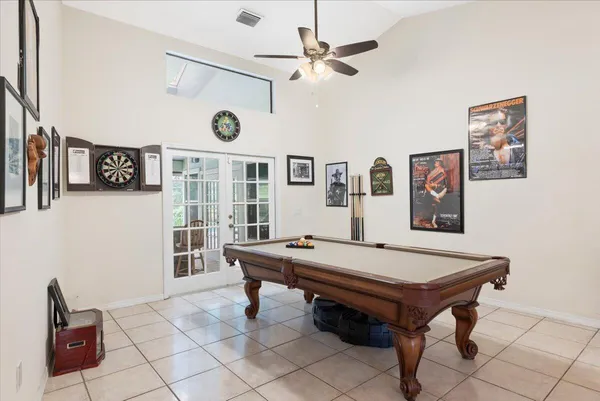 a view of a dining room with furniture wooden floor and chandelier