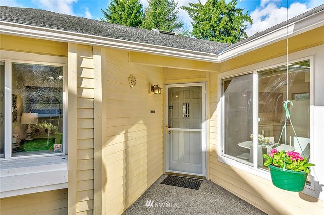 a view of a glass door with a balcony