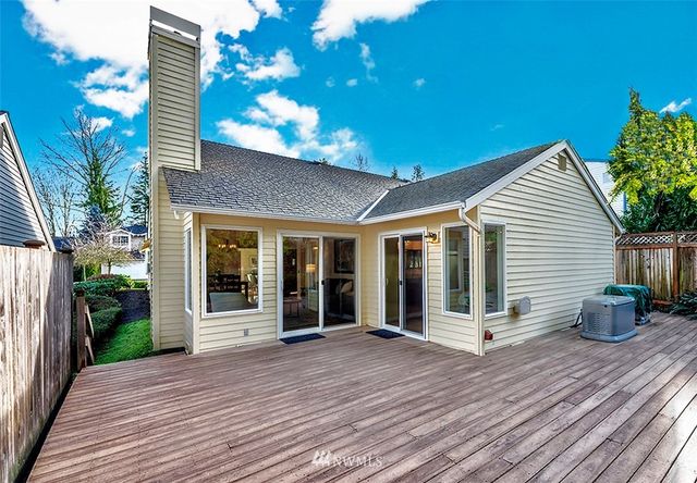 a view of a house with sitting area and garden