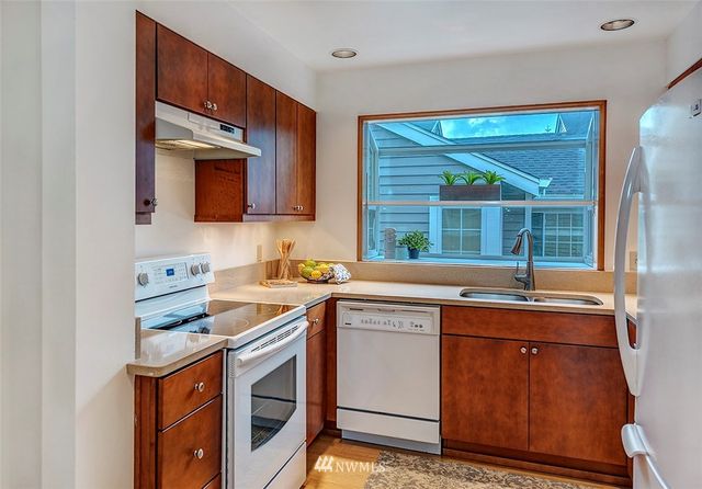a kitchen that has a sink and a stove