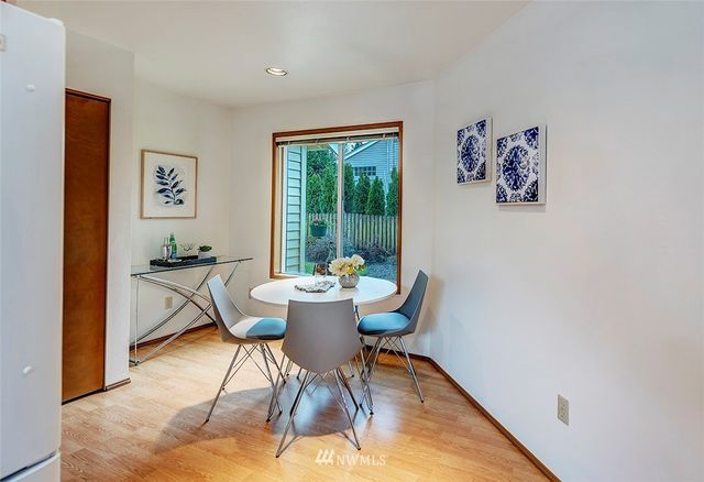 a workspace room with furniture and a window